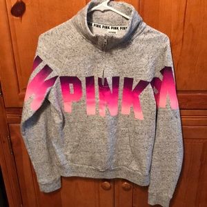 A grey quarter zip sweatshirt